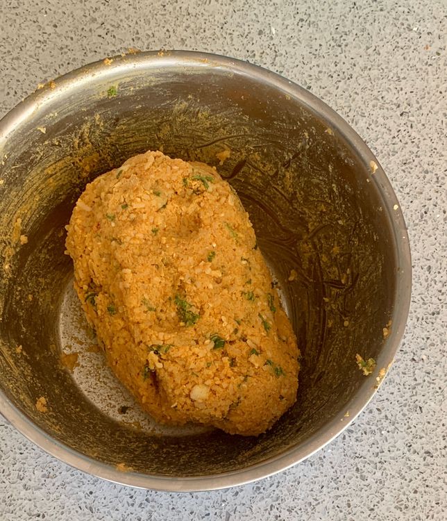 Step 1.2: In a mixing bowl, combine the boiled rice, boiled potato, green chillies, ginger, gram flour, red chilli powder, cumin powder, carom seeds, sesame seeds, turmeric, coriander powder, chat masala, salt and oil