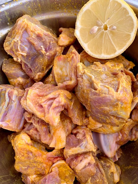 Step 1.1: Wash the goat pieces and drain out the excess water and marinate it with turmeric powder, salt and lemon juice