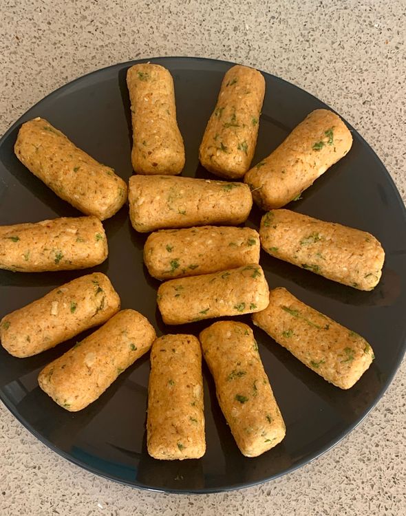 Step 1.2: Grease your palms with oil and take small portions of the dough