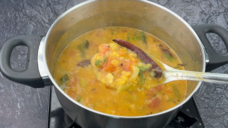 Step 6.1: Add the tempering to the cooked dal