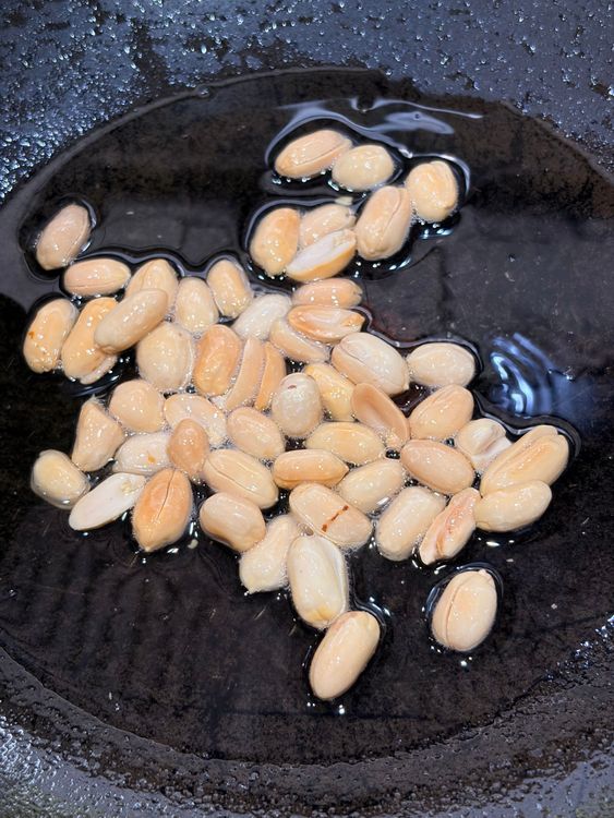 Step 1.1: Heat oil in a pan and fry the peanuts until golden and crisp