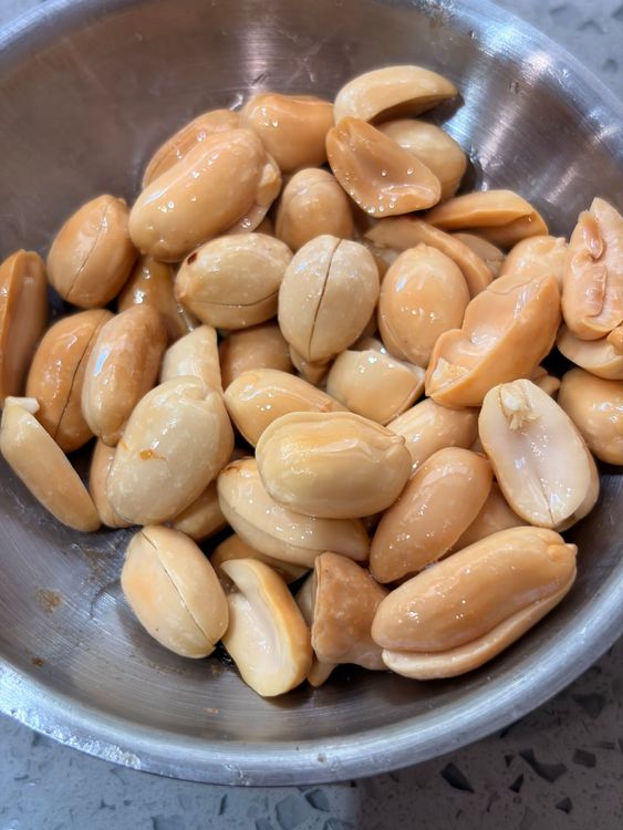 Step 1.2: Heat oil in a pan and fry the peanuts until golden and crisp
