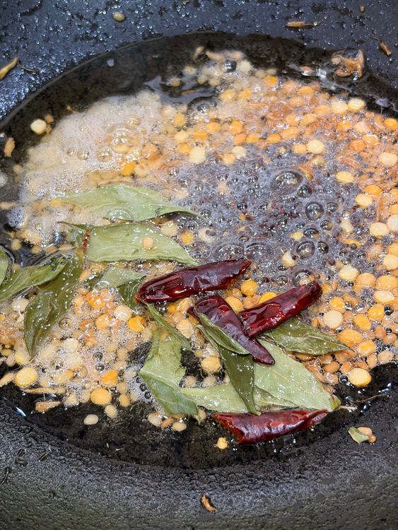 Step 1.1: Add the dry red chilli and curry leaves; sauté for a few seconds