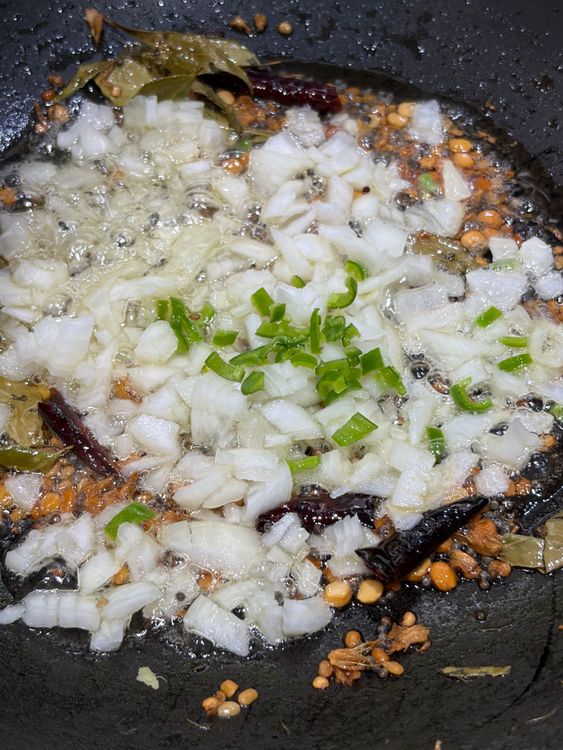 Step 1.1: Add chopped onions and green chilli