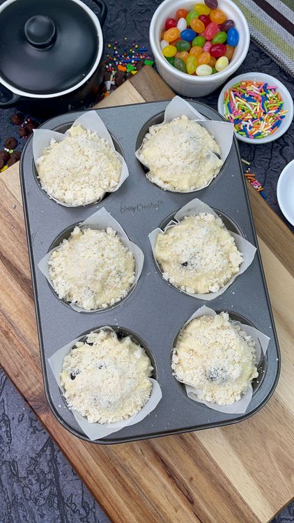 Step 6.1: Sprinkle a good amount of streusel on top of each muffin