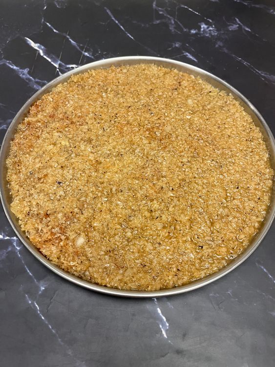 Step 6.1: Grease a steel plate or tray with ghee