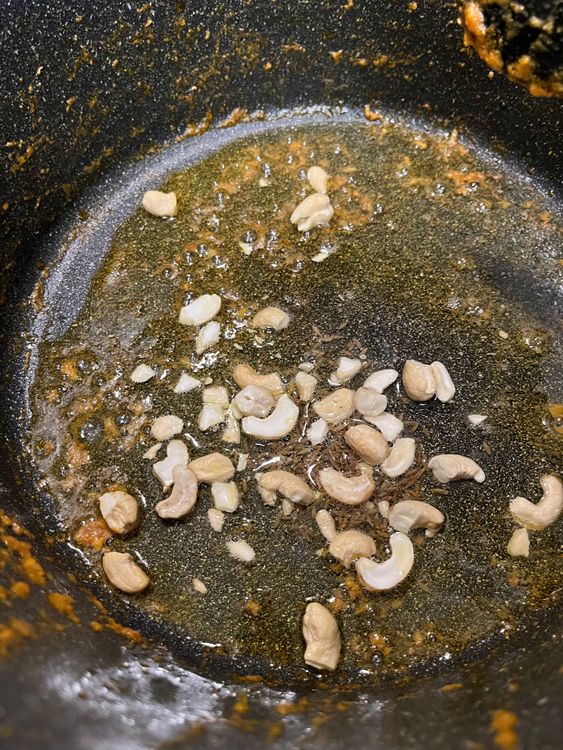 Step 4.1: Add cashews and fry until golden