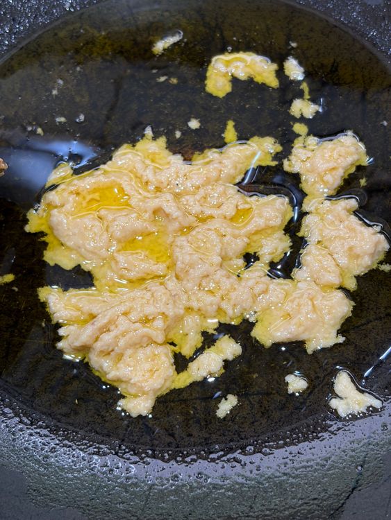 Step 3.1: Add ginger–garlic paste and sauté for 1–2 minutes until fragrant and lightly golden