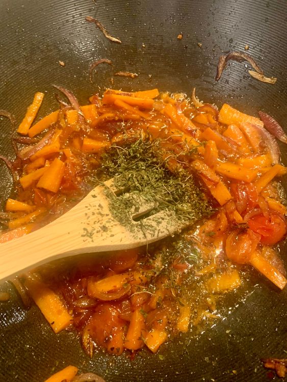 Step 2.2: Stir in the schezwan sauce, oregano, mixed herbs, white pepper powder, black pepper powder, dried basil leaves, and salt according to your taste