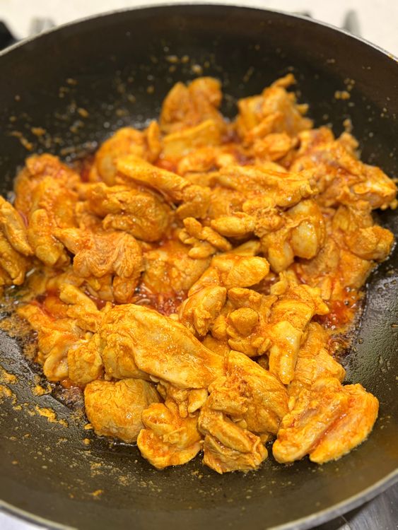 Step 3.2: Add the chicken pieces and cook on medium-high heat for 5-6 minutes, stirring occasionally, until sealed and lightly golden