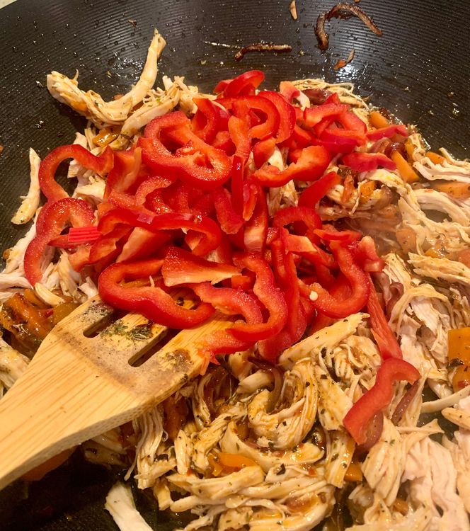 Step 2.1: Add the red bell pepper and vinegar to the wok and cook for a few minutes until slightly softened