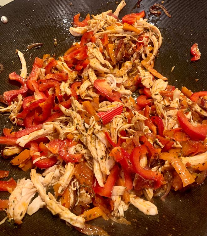 Step 2.2: Add the red bell pepper and vinegar to the wok and cook for a few minutes until slightly softened
