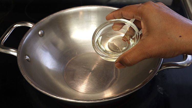 Step 1.1: Heat oil in a heavy-bottomed pan over medium heat