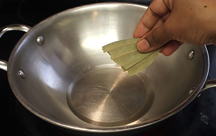 Step 1.2: Heat oil in a heavy-bottomed pan over medium heat