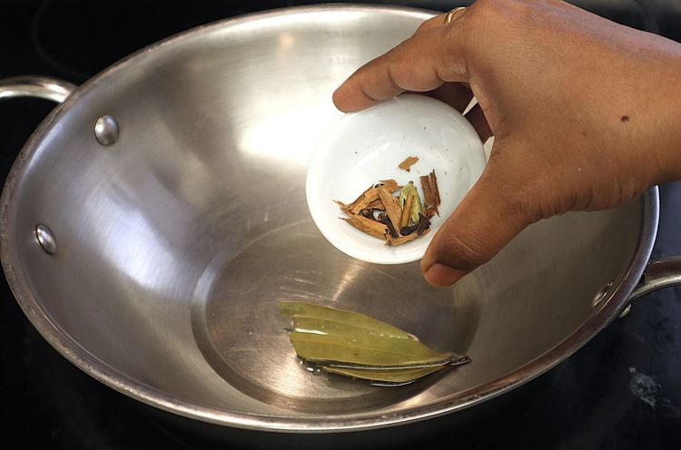 Step 1.3: Heat oil in a heavy-bottomed pan over medium heat