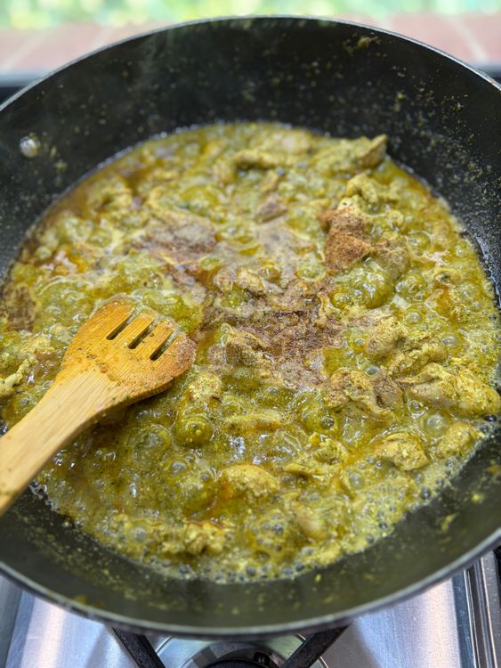 Step 3.2: Lower the heat, add whisked curd, and mix well