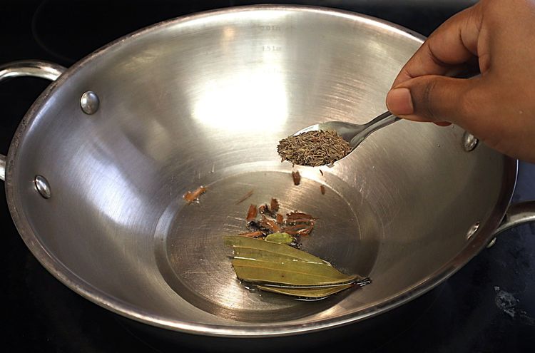 Step 1.4: Heat oil in a heavy-bottomed pan over medium heat