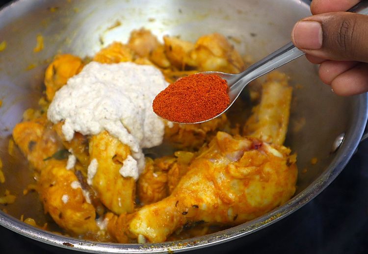 Step 1.3: Add the freshly ground masala paste, red chilli powder, and turmeric powder