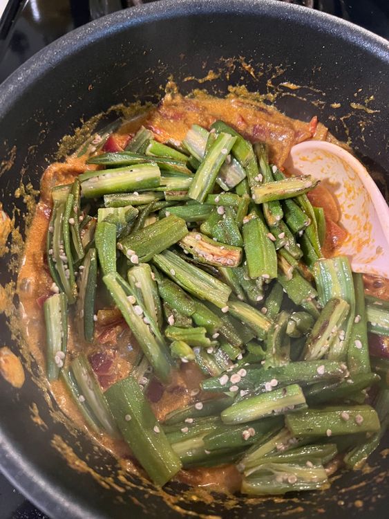 Step 1.1: Add the cooked bhindi to the mix, and stir well