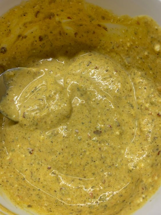 Step 2.1: In a mixing bowl, combine curd, coriander powder, black pepper powder, chilli flakes, garam masala, cumin powder and turmeric