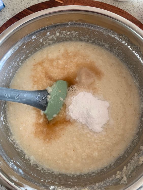 Step 2.1: Add the baking powder, baking soda, and vanilla extract to the batter, stirring gently to maintain a smooth, lump-free consistency