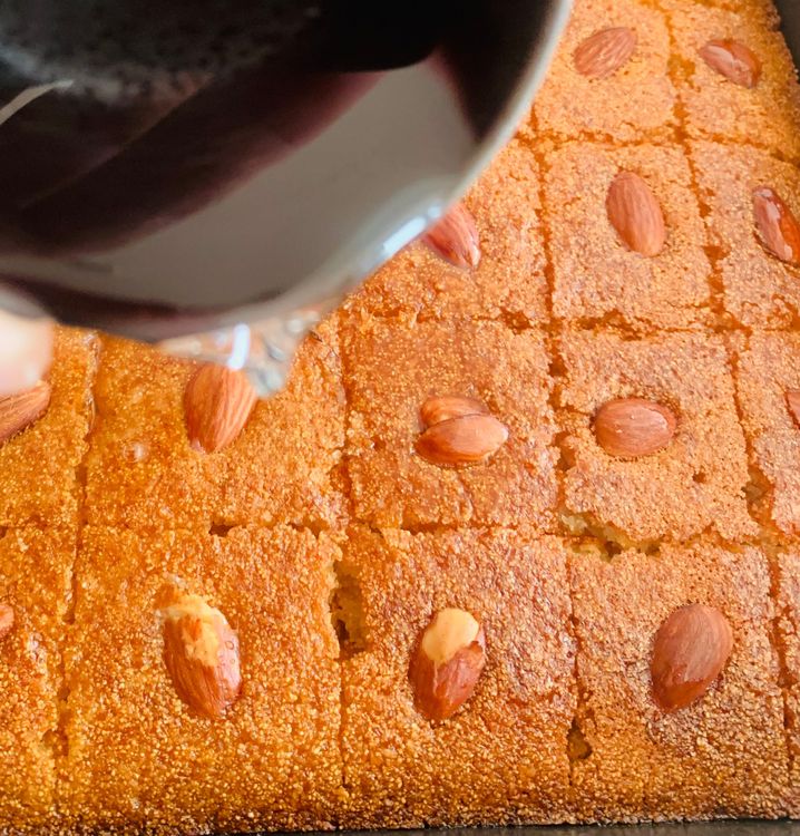Step 3.1: With the help of a knife, re-cut the squares or diamonds, and pour the cooled sugar syrup evenly all over the cake