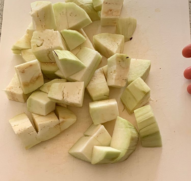 Step 1.1: Peel the eggplants and cut them into cubes
