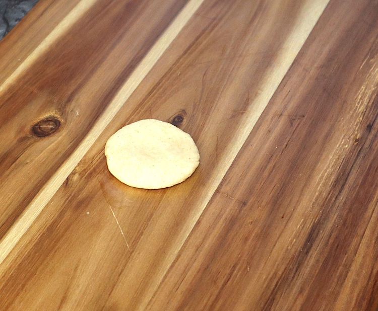 Step 1.1: Take a ball and roll using a rolling pin to a slightly thick thickness