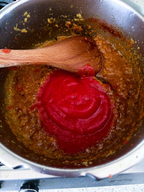 Step 2.1: Add tomato puree and cook for 1-2 minutes