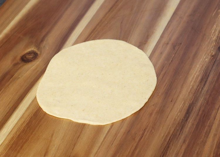 Step 1.2: Take a ball and roll using a rolling pin to a slightly thick thickness
