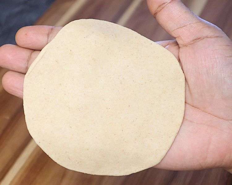 Step 1.3: Take a ball and roll using a rolling pin to a slightly thick thickness