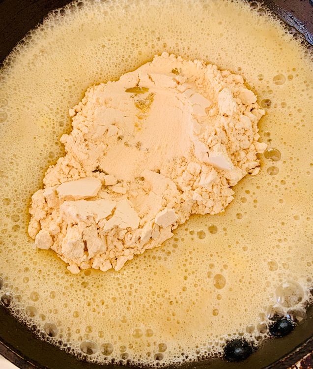 Step 2.1: Add gram flour and stir continuously until it loses its raw aroma and turns golden brown