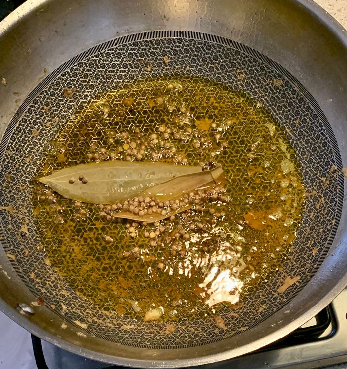 Step 1.1: Add bay leaves and coriander seeds and let them splutter