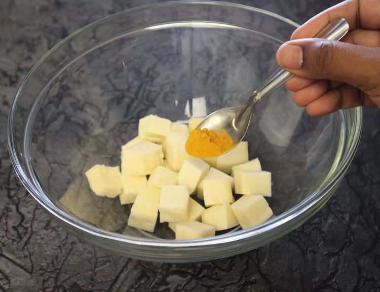 Step 1.3: In a large bowl, take paneer cubes, turmeric, chilli powder, ginger garlic paste, and salt