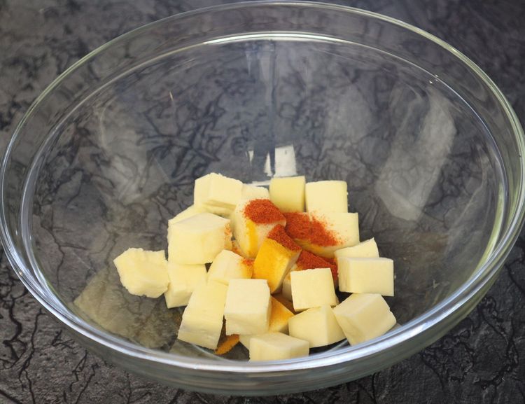 Step 1.5: In a large bowl, take paneer cubes, turmeric, chilli powder, ginger garlic paste, and salt