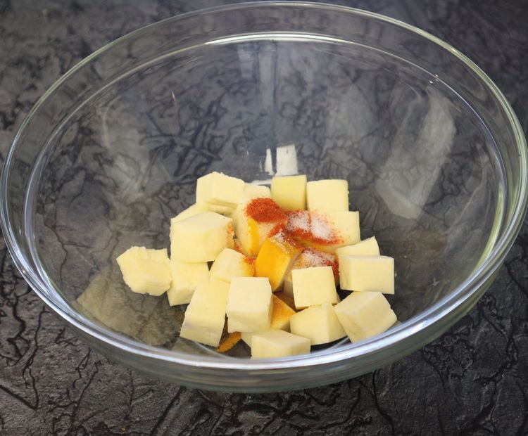 Step 1.7: In a large bowl, take paneer cubes, turmeric, chilli powder, ginger garlic paste, and salt