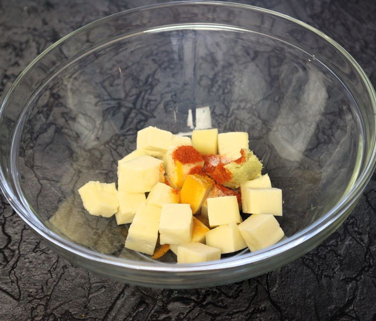 Step 1.9: In a large bowl, take paneer cubes, turmeric, chilli powder, ginger garlic paste, and salt