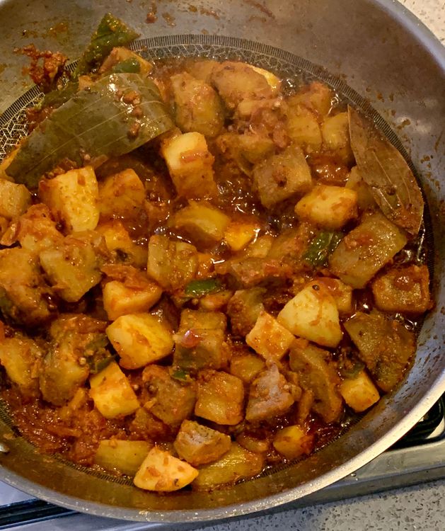 Step 1.1: Now, add the sauteed eggplants and potatoes to the wok
