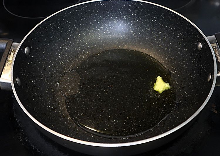 Step 2.4: In a large kadai, heat ghee and oil