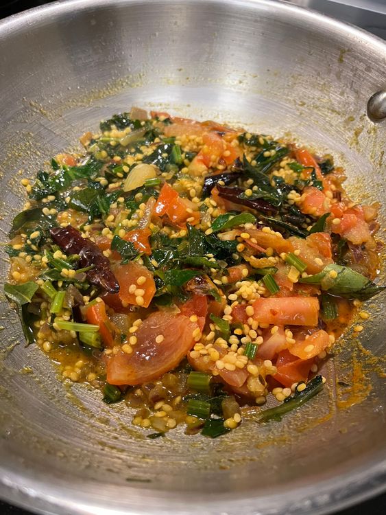 Step 5.1: Add chopped tomatoes, mix again, and cover the pan