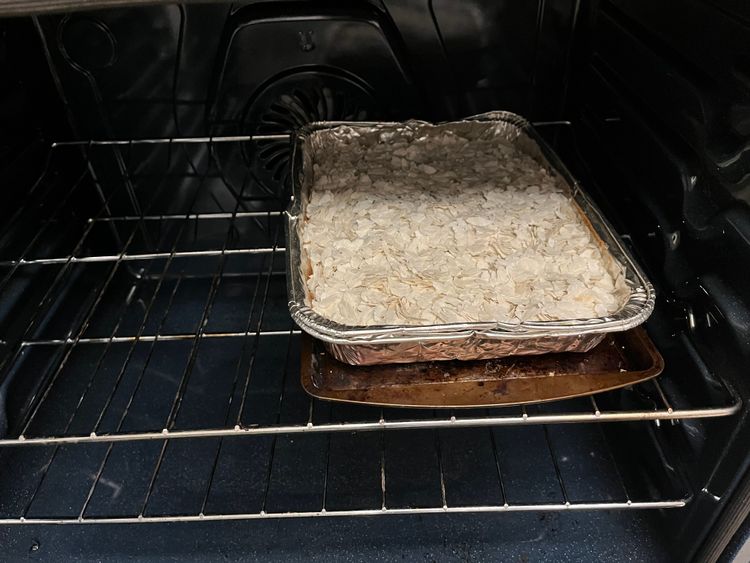 Step 1.1: If using the oven method, preheat oven to 330°F (165°C), spread poha evenly on a baking tray, and bake for 15 minutes