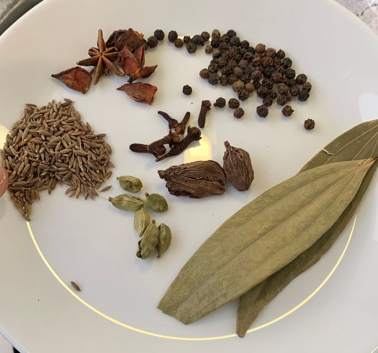 Step 1.1: Add cumin seeds, bay leaves, cloves, star anise, black cardamoms, green cardamoms, and peppercorns
