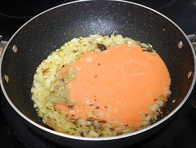 Step 2.2: Add tomato puree and mix well