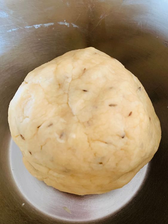Step 1.1: Gradually add the flour mixture to the wet ingredients, mixing gently with a spatula or your hands to form a soft dough