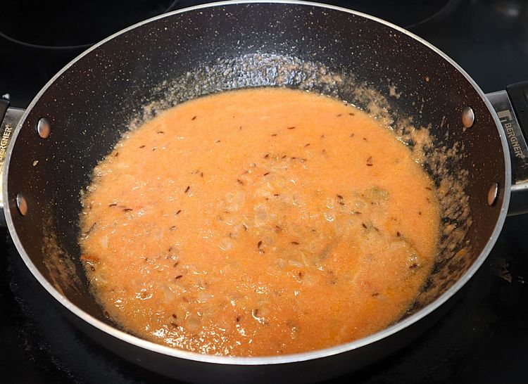 Step 2.3: Add tomato puree and mix well