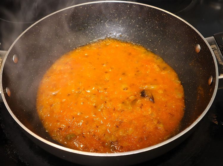 Step 2.6: Add tomato puree and mix well