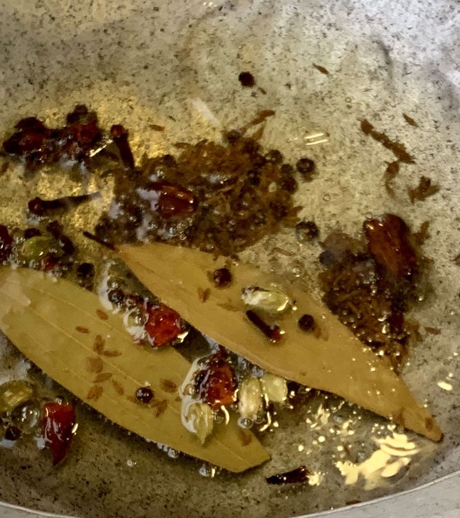 Step 1.2: Add cumin seeds, bay leaves, cloves, star anise, black cardamoms, green cardamoms, and peppercorns