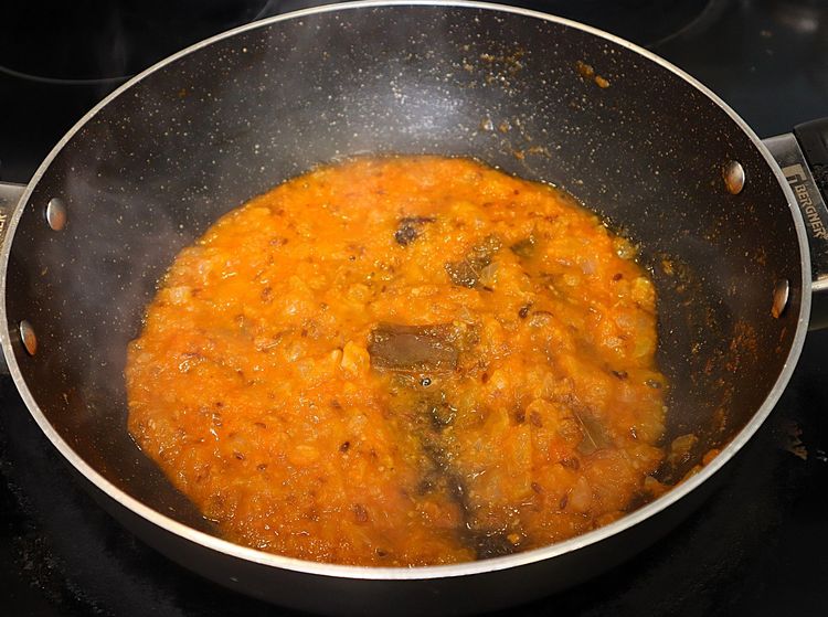 Step 2.7: Add tomato puree and mix well