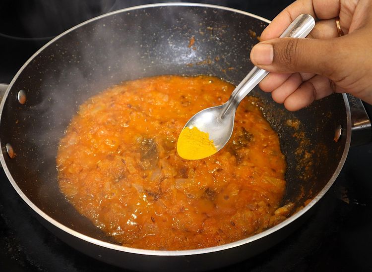 Step 2.1: * Furthermore keeping the flame on low, add ¼ tsp turmeric, 1 tsp chilli powder, 1 tsp coriander powder, ½ tsp cumin powder, ½ tsp garam masala and 1 tsp salt