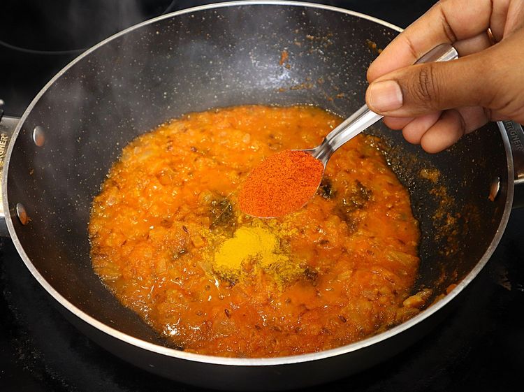 Step 2.2: * Furthermore keeping the flame on low, add ¼ tsp turmeric, 1 tsp chilli powder, 1 tsp coriander powder, ½ tsp cumin powder, ½ tsp garam masala and 1 tsp salt